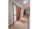 Entryway with tiled floor and a partial view of the living room featuring fireplace at 1212 Foxfire Dr, Apopka, FL 32712