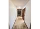 Inviting hallway with tile flooring leads to spacious rooms with abundant natural light, and modern design at 1212 Foxfire Dr, Apopka, FL 32712