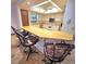Bright kitchen with white cabinets, bar seating and a functional layout ideal for cooking and gathering at 1212 Foxfire Dr, Apopka, FL 32712
