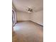 Large living room with a ceiling fan and sliding glass doors to the backyard at 1212 Foxfire Dr, Apopka, FL 32712