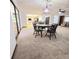 The open floor plan connecting dining, living room, and kitchen promotes a seamless flow for entertaining and everyday living at 1212 Foxfire Dr, Apopka, FL 32712