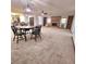 Open floor plan connecting dining, living room, and kitchen with warm fireplace and natural light at 1212 Foxfire Dr, Apopka, FL 32712