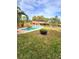 Enjoy the backyard pool perfect for relaxation and entertaining in this beautiful landscaped yard with mature trees at 1212 Foxfire Dr, Apopka, FL 32712