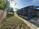 Large fenced in back yard with a screened in patio and pool at 1221 Perkins Rd, Orlando, FL 32809