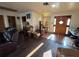 Inviting living room with hardwood floors and a unique wooden door at 1221 Perkins Rd, Orlando, FL 32809