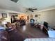 Living room with wood floors and lots of natural light from the adjacent rooms at 1221 Perkins Rd, Orlando, FL 32809