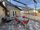 Covered patio with a table and chairs, perfect for outdoor dining and entertaining at 1221 Perkins Rd, Orlando, FL 32809