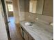 Well-lit bathroom features a tile floor and marble vanity at 132 Terrace Dr, Winter Haven, FL 33884
