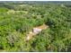 Aerial view of the home nestled among lush trees and sprawling landscape at 1406 Cr 542G, Bushnell, FL 33513