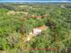 Aerial view outlining the property lines surrounded by lush trees and landscape at 1406 Cr 542G, Bushnell, FL 33513