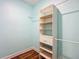 Walk-in closet with built-in shelving and a hanging rod for storage at 1406 Cr 542G, Bushnell, FL 33513