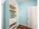 Walk-in closet featuring built-in shelving and hanging rods for storage at 1406 Cr 542G, Bushnell, FL 33513