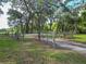 View of the metal entrance gate to the property and grounds at 1406 Cr 542G, Bushnell, FL 33513