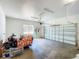 Spacious two-car garage featuring white walls, and garage door opener at 1406 Cr 542G, Bushnell, FL 33513