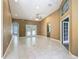 Expansive living room featuring vaulted ceilings, recessed lighting, and access to the backyard at 1406 Cr 542G, Bushnell, FL 33513