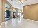 Open and inviting living room with tile flooring and view of the front entrance at 1406 Cr 542G, Bushnell, FL 33513