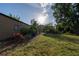 Expansive backyard featuring lush greenery, offering a serene outdoor retreat at 15714 Turkey Farm Rd, Minneola, FL 34715