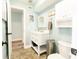 Charming bathroom with a white vanity, neutral color scheme, and modern fixtures for a comfortable and refreshing experience at 15714 Turkey Farm Rd, Minneola, FL 34715