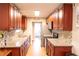 Well-equipped kitchen featuring granite countertops, stainless steel appliances, and ample cabinet space for culinary enthusiasts at 15714 Turkey Farm Rd, Minneola, FL 34715