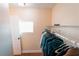 Bright walk-in closet with shelving and storage for organizing clothes and personal items at 15714 Turkey Farm Rd, Minneola, FL 34715
