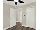 Bedroom features wood-look flooring, neutral paint, closet, base molding, and a ceiling fan with lighting at 1805 Knox Ave, Sanford, FL 32771