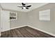 Bedroom featuring hardwood floors, a ceiling fan and a window at 1805 Knox Ave, Sanford, FL 32771