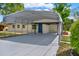A house showing a long carport running from the street to the front door at 1805 Knox Ave, Sanford, FL 32771