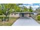 Charming single-story home with a covered carport and well-maintained front yard at 1805 Knox Ave, Sanford, FL 32771