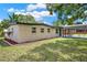 Charming one-story home featuring manicured landscaping, a carport, and a brick exterior at 1805 Knox Ave, Sanford, FL 32771