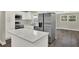 Renovated kitchen with white cabinets, stainless steel appliances, and modern countertops at 1805 Knox Ave, Sanford, FL 32771