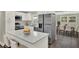 Kitchen featuring white cabinets, stainless steel appliances and island with sitting at 1805 Knox Ave, Sanford, FL 32771