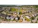 Aerial shot of a modern neighborhood with neatly arranged homes, sidewalks, and manicured landscaping at 1873 White Feather Loop, Oakland, FL 34787