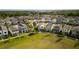 Aerial view of new suburban neighborhood, showcasing neatly arranged homes, green spaces, and community at 1873 White Feather Loop, Oakland, FL 34787