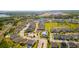 Neighborhood aerial view showcases community amenities, a lush green field, and well maintained homes at 1873 White Feather Loop, Oakland, FL 34787