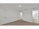 Carpeted bedroom with double-door closet, and view into ensuite bathroom and walk in closet at 2081 Viewfinder St, Kissimmee, FL 34758