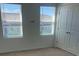 Bright bedroom with two windows and a double door closet at 2081 Viewfinder St, Kissimmee, FL 34758