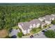 Birds eye view of residential buildings surrounded by trees and parking lots at 2300 Silver Palm Dr # 205, Kissimmee, FL 34747