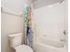 Clean bathroom featuring a white tiled shower-tub combo and decorative shower curtain at 2300 Silver Palm Dr # 205, Kissimmee, FL 34747