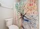Bathroom with a colorful tree-themed shower curtain at 2300 Silver Palm Dr # 205, Kissimmee, FL 34747