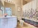 A bathroom with a single vanity, toilet, and shower/tub combo at 2300 Silver Palm Dr # 205, Kissimmee, FL 34747