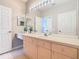 Vanity in bathroom with large mirror, good lighting, and ample storage at 2300 Silver Palm Dr # 205, Kissimmee, FL 34747
