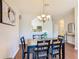 Well-lit dining room showing view into the open kitchen at 2300 Silver Palm Dr # 205, Kissimmee, FL 34747