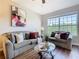 Comfortable living room features large windows and cozy seating at 2300 Silver Palm Dr # 205, Kissimmee, FL 34747