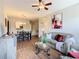Comfortable living area with hardwood floors, neutral color scheme, and an open layout into the dining area at 2300 Silver Palm Dr # 205, Kissimmee, FL 34747