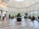 Bright community lobby with an abundance of windows, decorative floors and plenty of seating at 2300 Silver Palm Dr # 205, Kissimmee, FL 34747