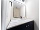 Modern bathroom with a stylish mirror, sleek black faucet, and a white countertop at 2308 Holly Pine Cir, Orlando, FL 32820