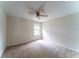 Bedroom with neutral carpet, light walls, and a ceiling fan offers comfortable living space at 2308 Holly Pine Cir, Orlando, FL 32820