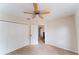 Bedroom featuring carpeting, a ceiling fan, and closet doors, ideal for comfort at 2308 Holly Pine Cir, Orlando, FL 32820