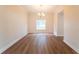 A formal dining room with wooden floors, chandelier, and natural light at 2308 Holly Pine Cir, Orlando, FL 32820