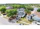 Exterior shot of a two-story home near a lake with a well-manicured lawn at 2308 Holly Pine Cir, Orlando, FL 32820